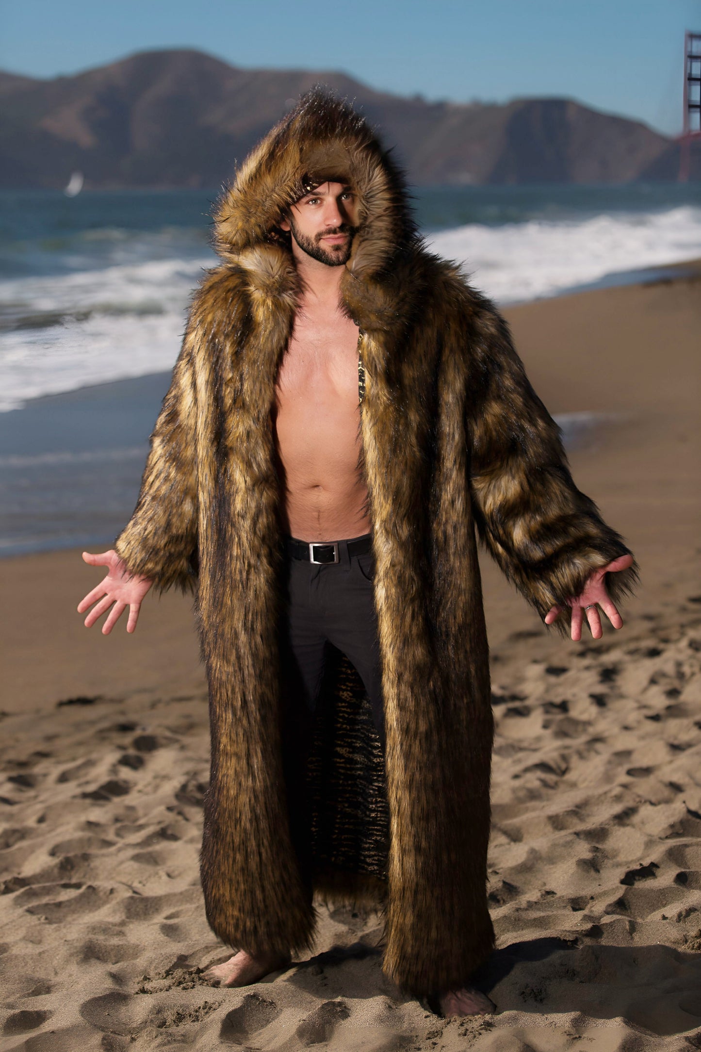 This versatile custom-made faux fur coat is perfect for festivals and Burning Man. Featuring practical zipped pockets, it effortlessly merges coziness with style. Embrace this garment to radiate a commanding aura reminiscent of a majestic bear.